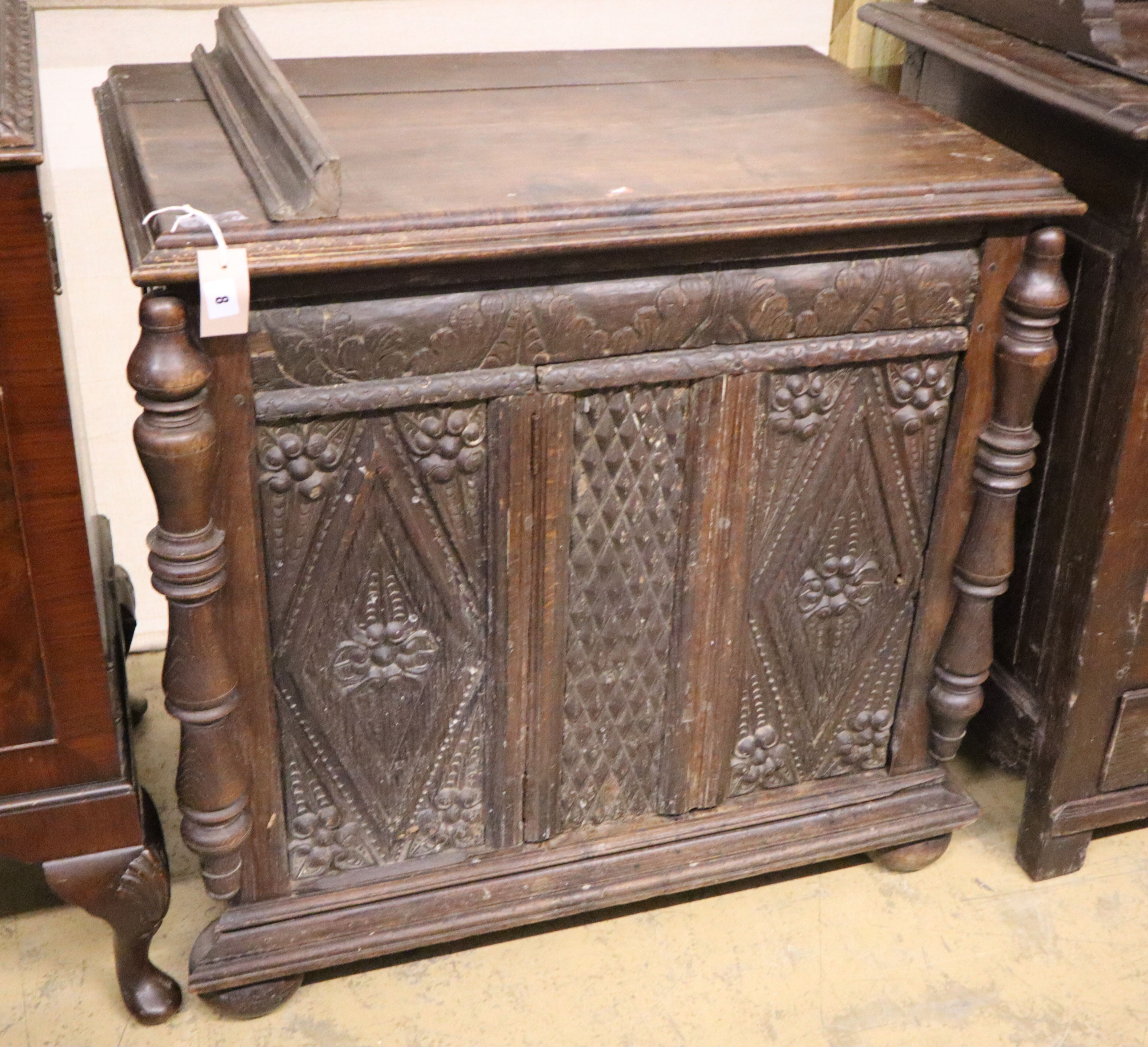 An 18th century and later carved oak side cabinet, width 83cm, depth 52cm, height 82cm